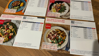 Gousto recipe cards laid out on our writer's kitchen worktop