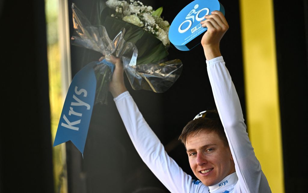 UAE Team Emirates teams Slovenian rider Tadej Pogacar celebrates with the best young riders white jersey on the podium after the 20th stage of the 109th edition of the Tour de France cycling race 407 km individual time trial between LacapelleMarival and Rocamadour in southwestern France on July 23 2022 Photo by AnneChristine POUJOULAT AFP Photo by ANNECHRISTINE POUJOULATAFP via Getty Images