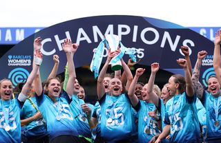 Teyah Goldie of London City Lionesses lifts the Barclays Women's Championship trophy after London City Lionesses win the Barclays Women's Championship and subsequently gain promotion to the Barclays Women's Super League after the Barclays Women's Championship match between Birmingham City and London City Lionesses at St Andrew’s at Knighthead Park on May 04, 2025 in Birmingham, England.