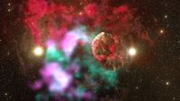 Lots of colorful blobs against a dark background of space. Toward the right, there is a spherical cloud-shaped object that's gray and red.