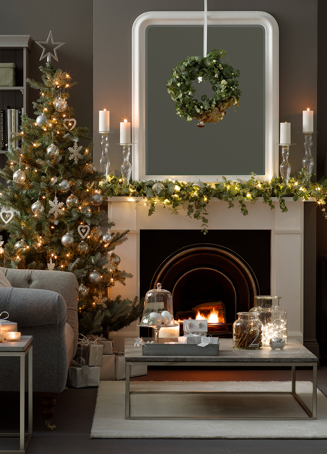 grey living room decorated for Christmas