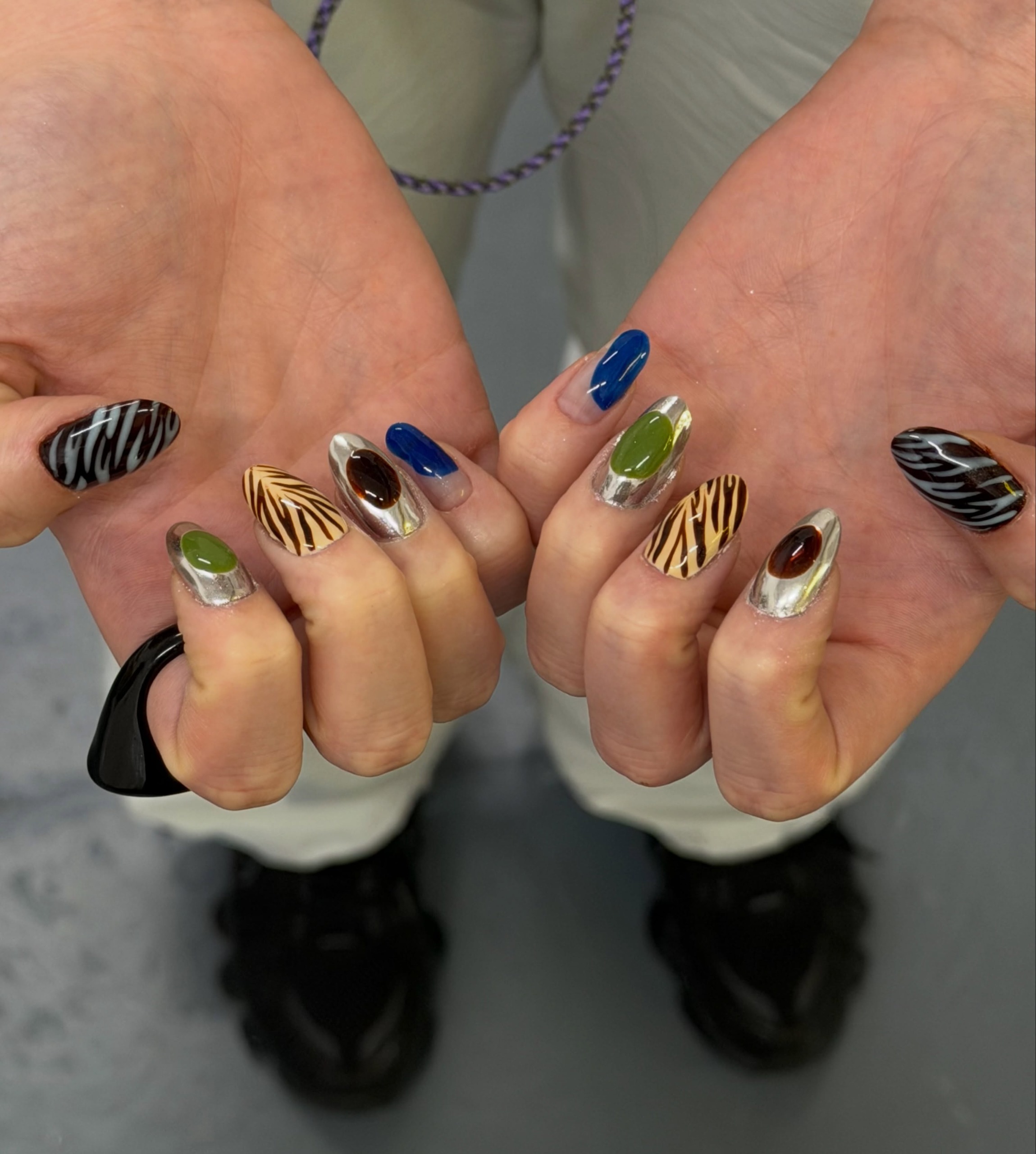 tiger and zebra nail art mixed with cobalt blue, olive green, and silver chrome