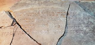 The remarkable stone inscription that once served as a Torah reading table.