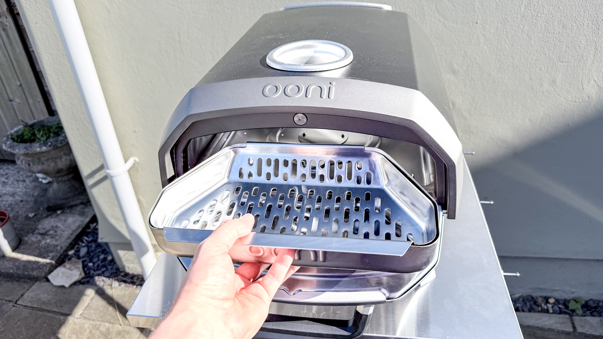 Ooni Karu 2 pizza oven fuel tray in hand