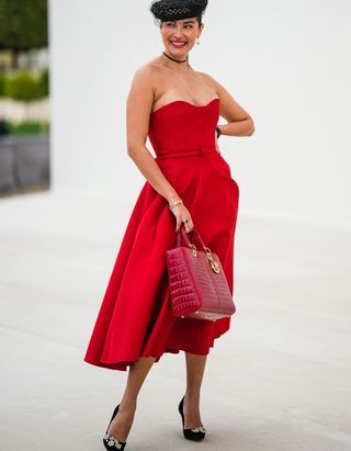 Paris fashion week street style - lady in red dress