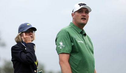 Kokrak looks bemused whilst talking to a Masters official