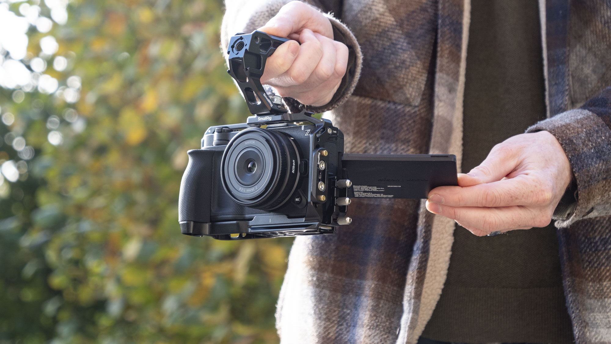 Nikon ZR product photos – inside a dedicated SmallRig cage, held by user