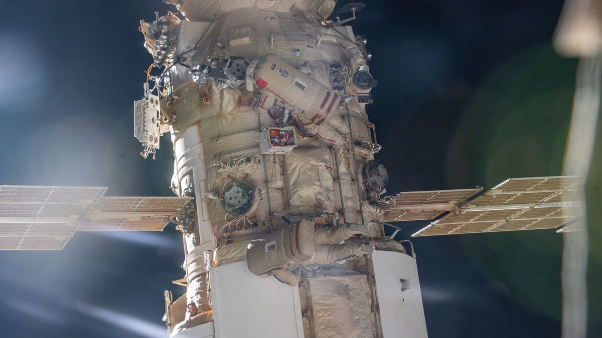 Watch Russian spacewalkers boot up a European robotic arm on the International S..