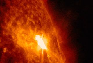 Solar Flare from Heart-Shaped Sunspot