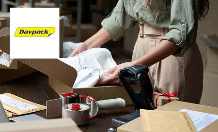 davpack logo top left with a woman packing a box