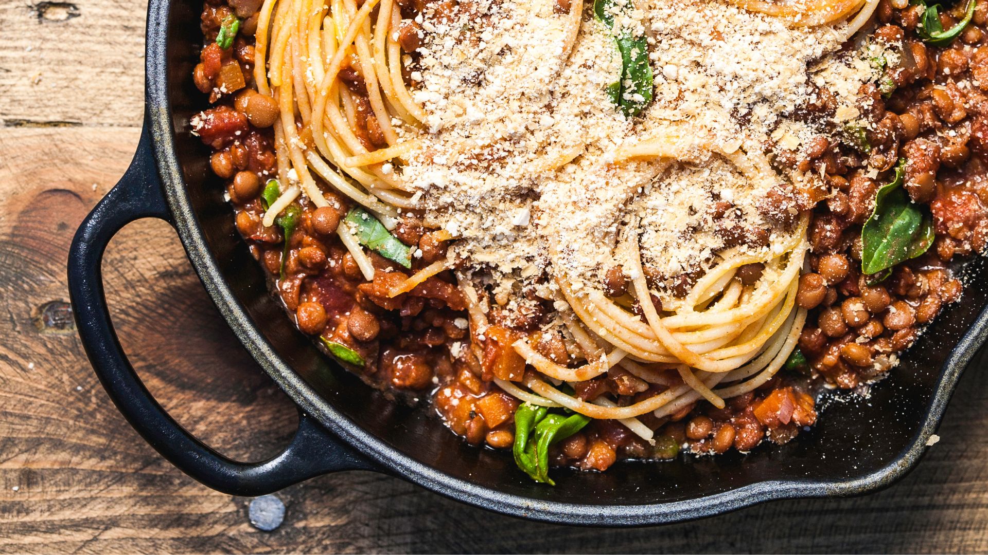 Lentil pasta with bolognese in bowl