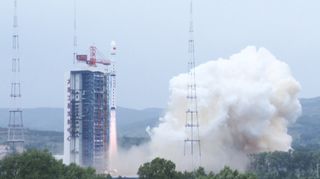 A Chinese Long March 4B rocket lifts off from Taiyuan Satellite Launch Center in the province of Shanxi . The rocket carried the Ziyuan III 03 Earth-mapping satellite and two other satellites to hunt dark matter and collect data.