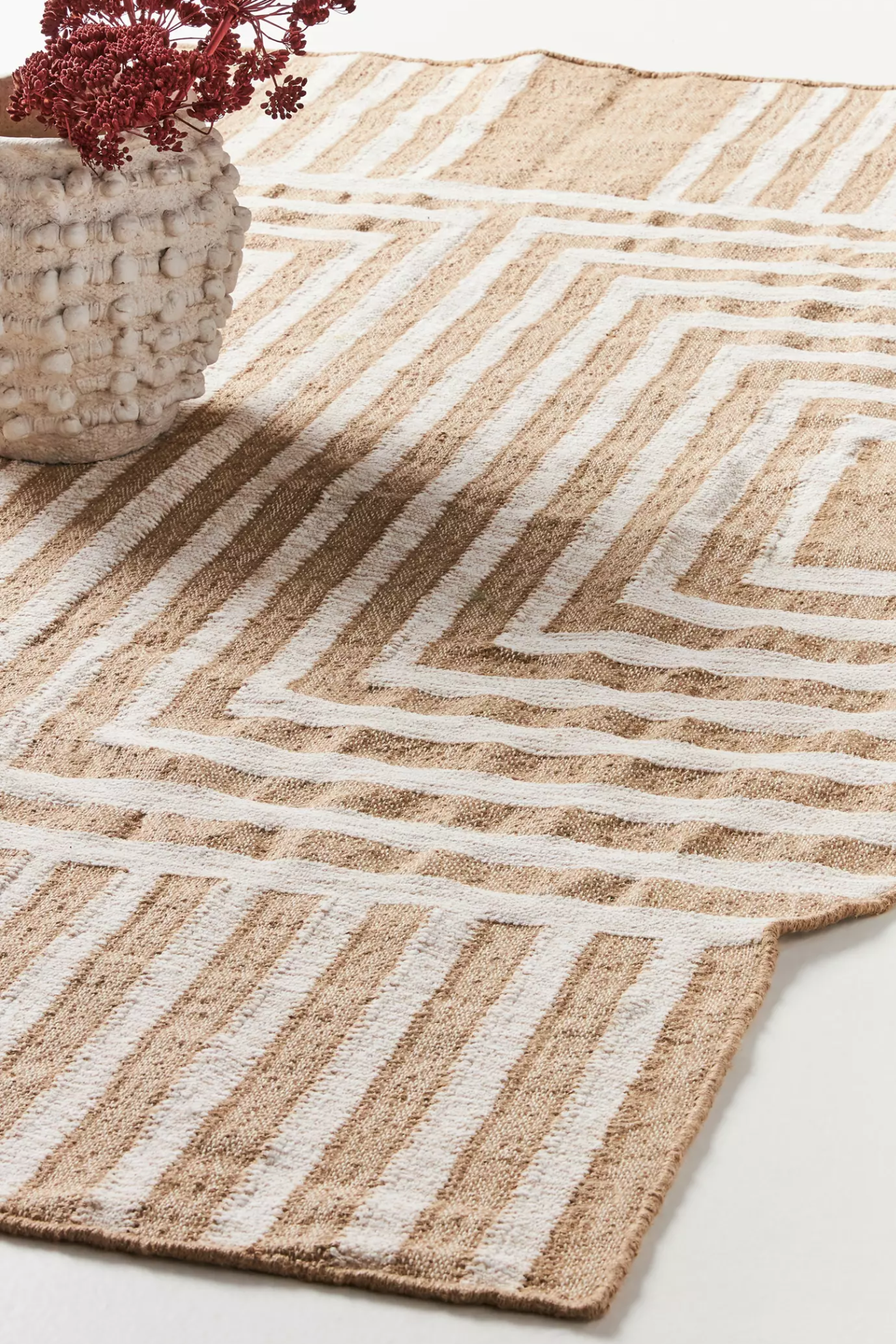 Close up of a jute rug with stripes