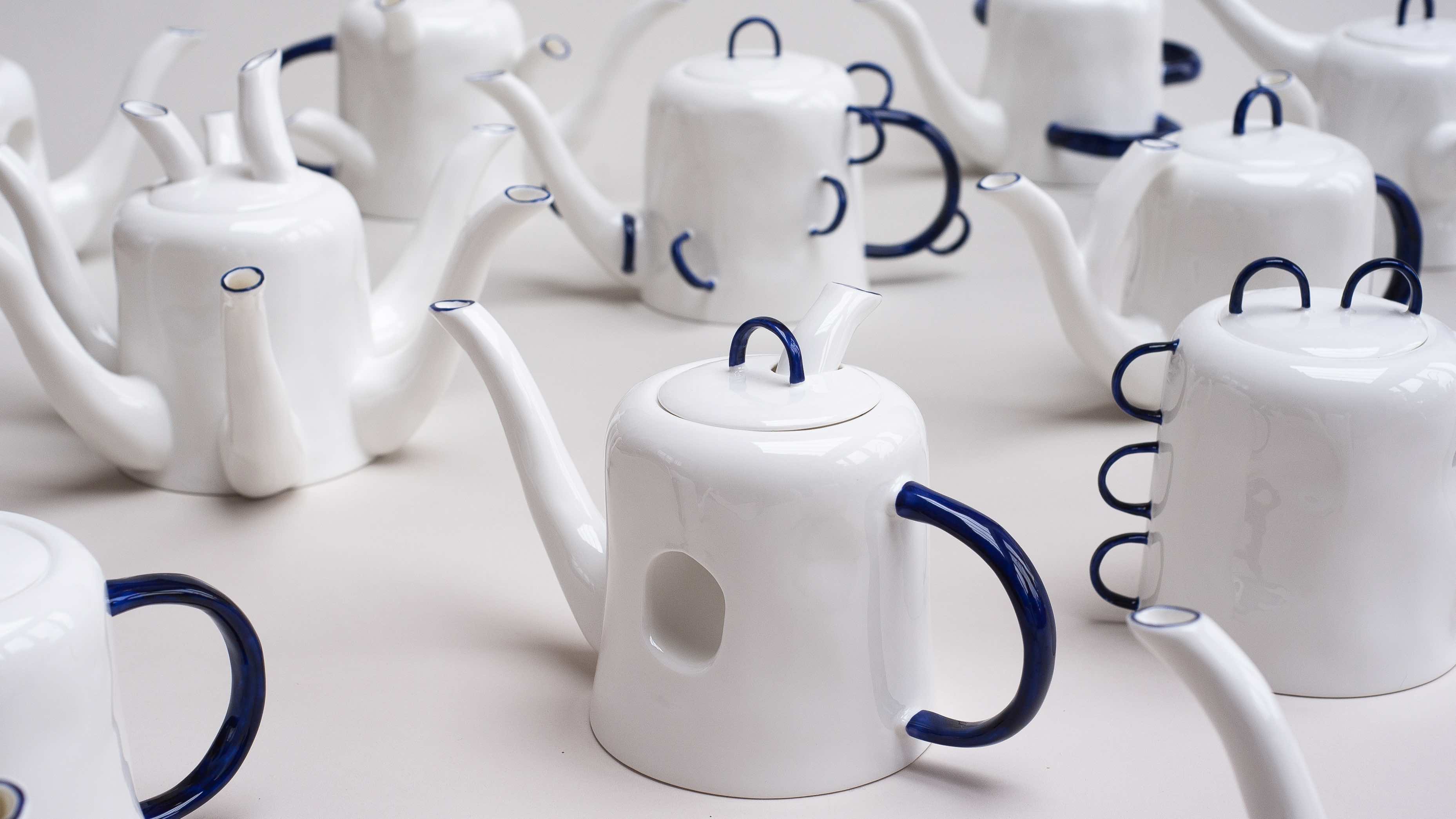 white bone china teapots with blue handles 