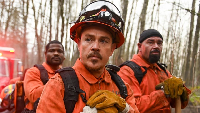 Kevin Alejandro as Manny with two men standing behind him. They&#039;re all resting their hands on shovels. 