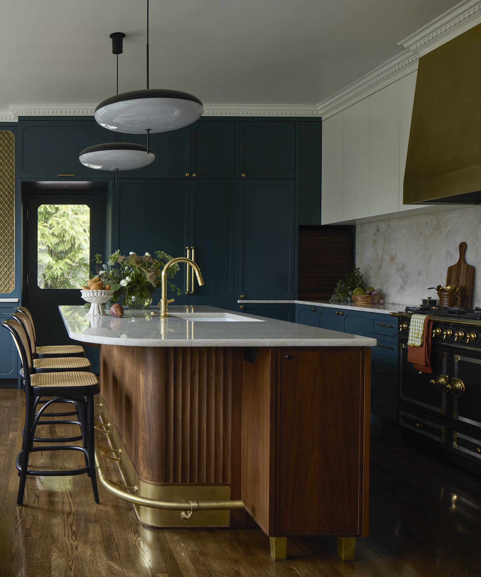 kitchen with wood island and dark color walls