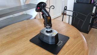 The Thrustmaster AVA F/A-18 Super Hornet Flight Stick on a table