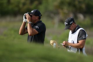 Phil Mickelson using a rangefinder during the 2021 PGA Championship