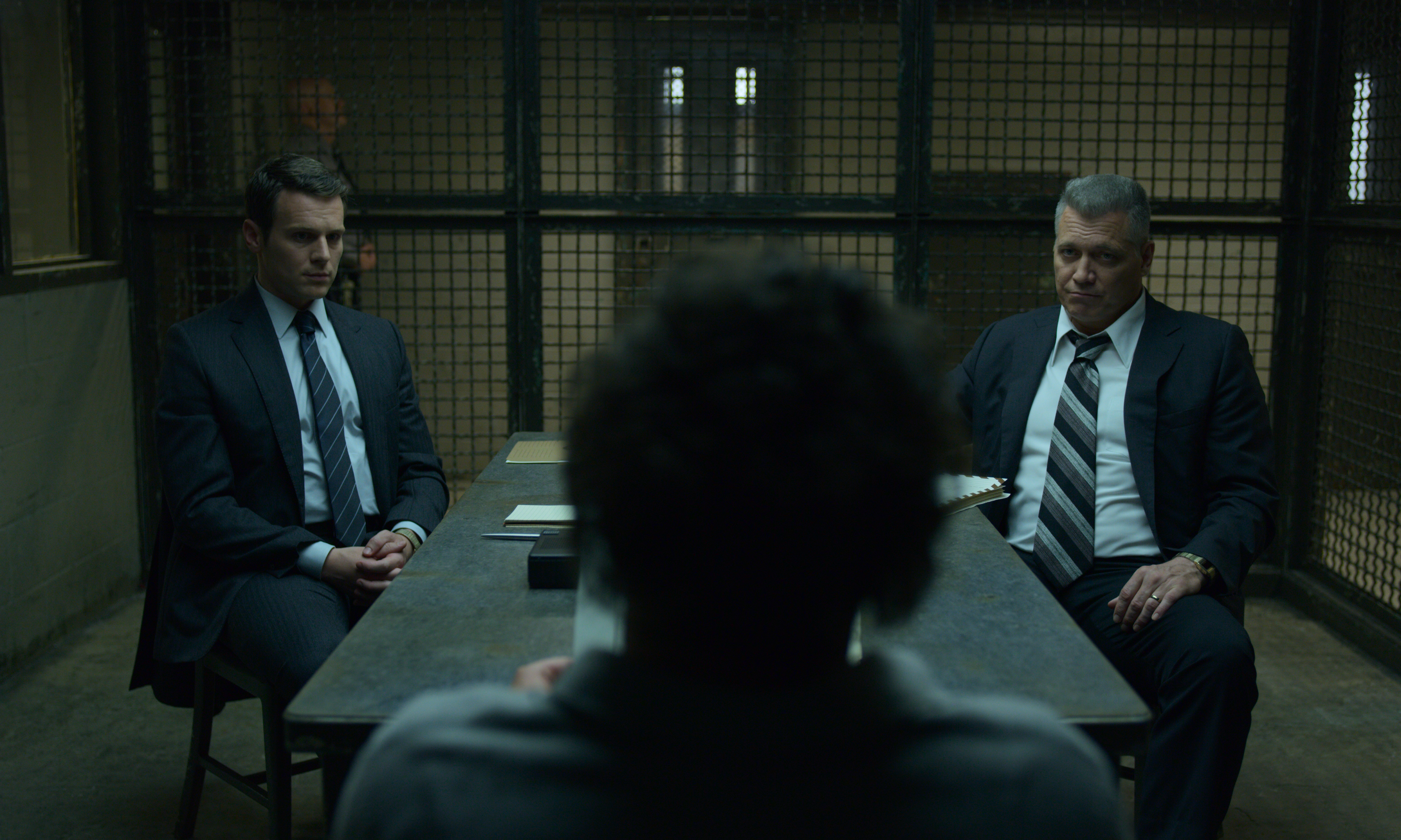 A screenshot of two detectives interrogating a witness in Mindhunter on Netflix