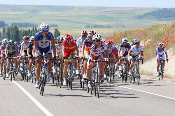 The bunch climbs in the picturesque countryside