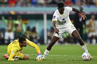 Inaki Williams controls the ball as he is challenged by Portugal's goalkeeper #22 Diogo Costa during the Qatar 2022 World Cup Group H football match between Portugal and Ghana at Stadium 974 in Doha on November 24, 2022.