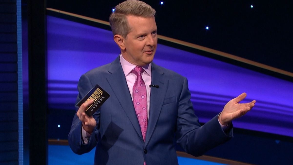 Ken Jennings gestures while hosting the show on Jeopardy! Masters.