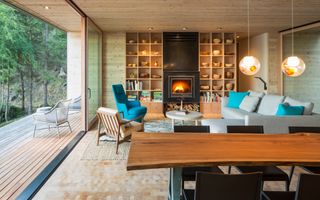 living room with blue mid century chairs and wood table