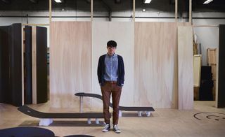 designer JinSik Kim with prototypes of the miniature fairways