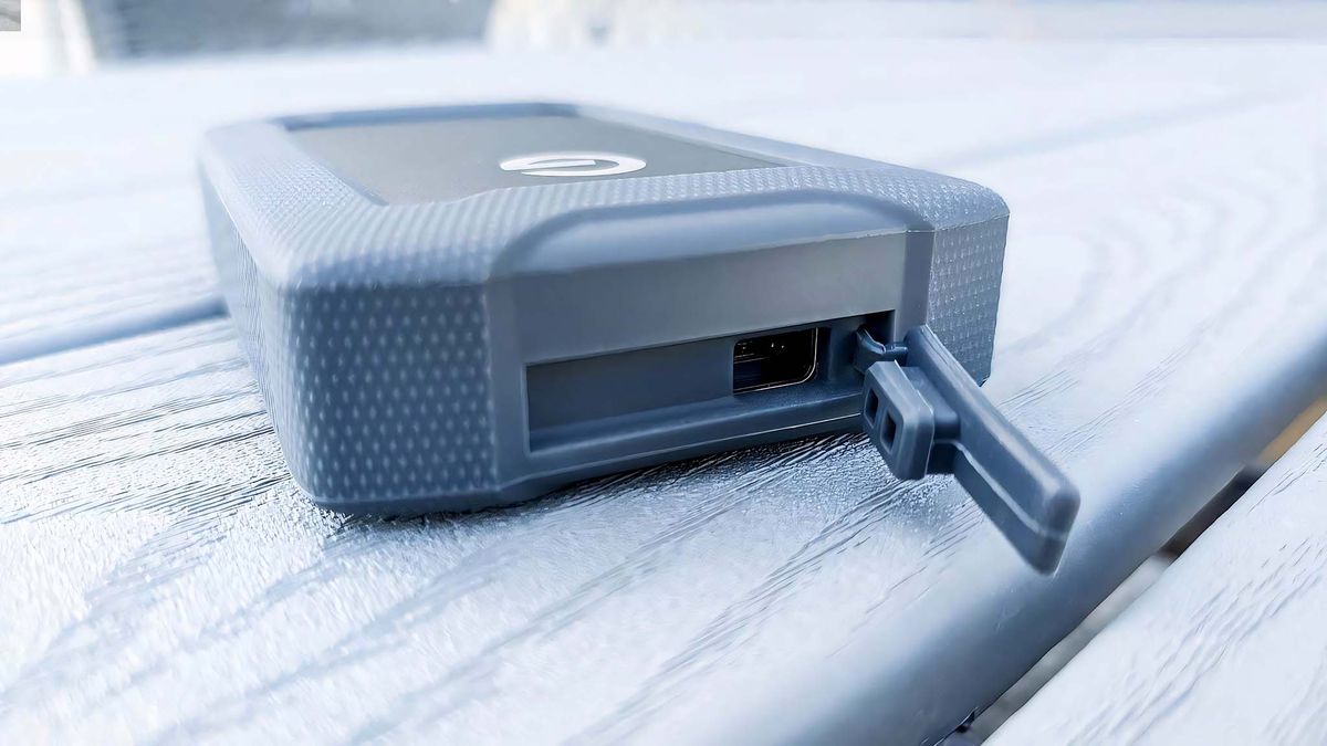 SanDisk Professional G-DRIVE ArmorATD rubber USB-C port door open.