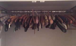 cluttered wardrobe of coat hangers