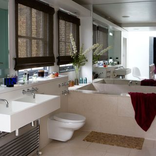 bathroom with white wall and wash basin