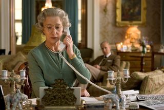 helen mirren as queen elizabeth answering a phone in her office in the movie the queen