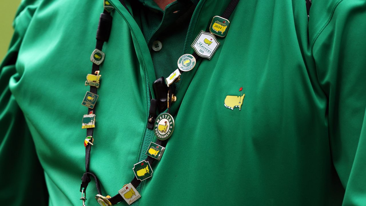 A Masters patron&#039;s Masters jacket and pins on lanyard