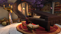 An elf sits at a custom-made grand piano in World of Warcraft's player housing system.