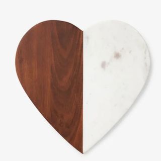 Heart shaped serving board on table 