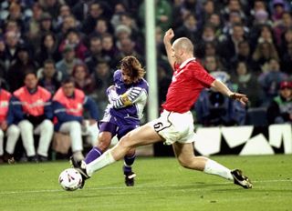Manchester United's Jaap Stam attempts to block a shot from Fiorentina's Gabriel Batistuta in a Champions League clash in 1999.