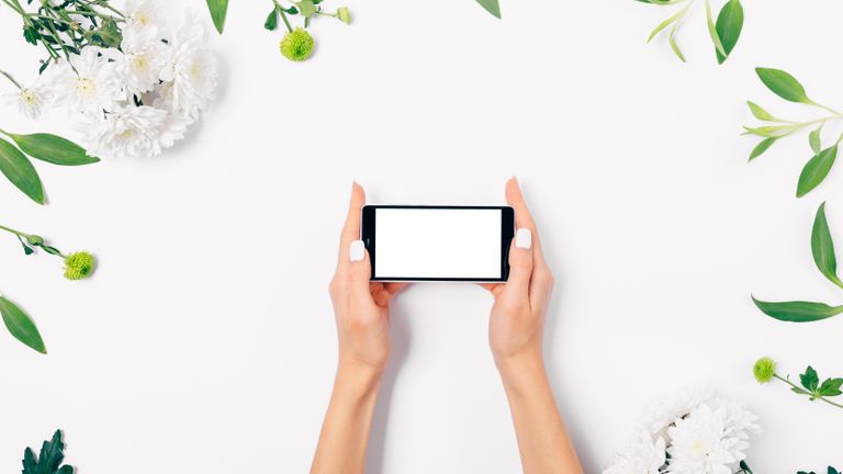 woman's hands holding clean mobile phone