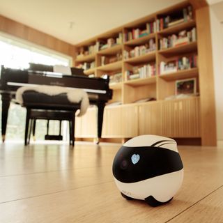 ebo air device on wooden floor near piano