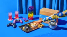 A woman's hand reaching for a bowl of popcorn, surrounded by various products and an Amazon Prime Day deals box.