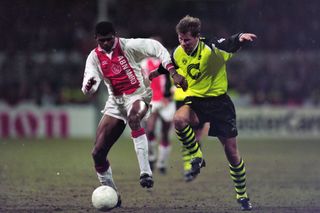 Nwankwo Kanu (left) in action for Ajax against Borussia Dortmund in the Champions League in March 1996.