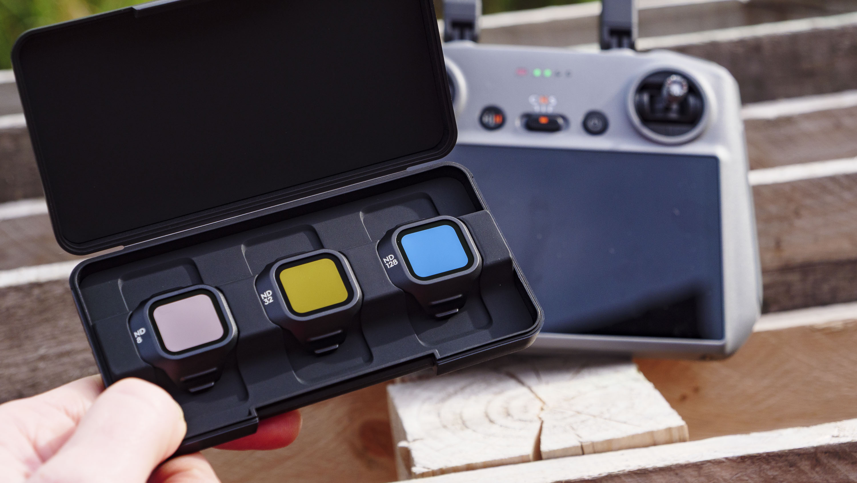 DJI Mini 5 Pro's ND filter set, with RC 2 controller in the background