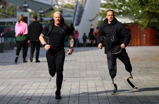 Iwan Thomas and Richard Whitehead on the run in 'Celebrity Hunted'.