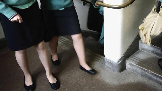 Two female pupils wearing school uniform 