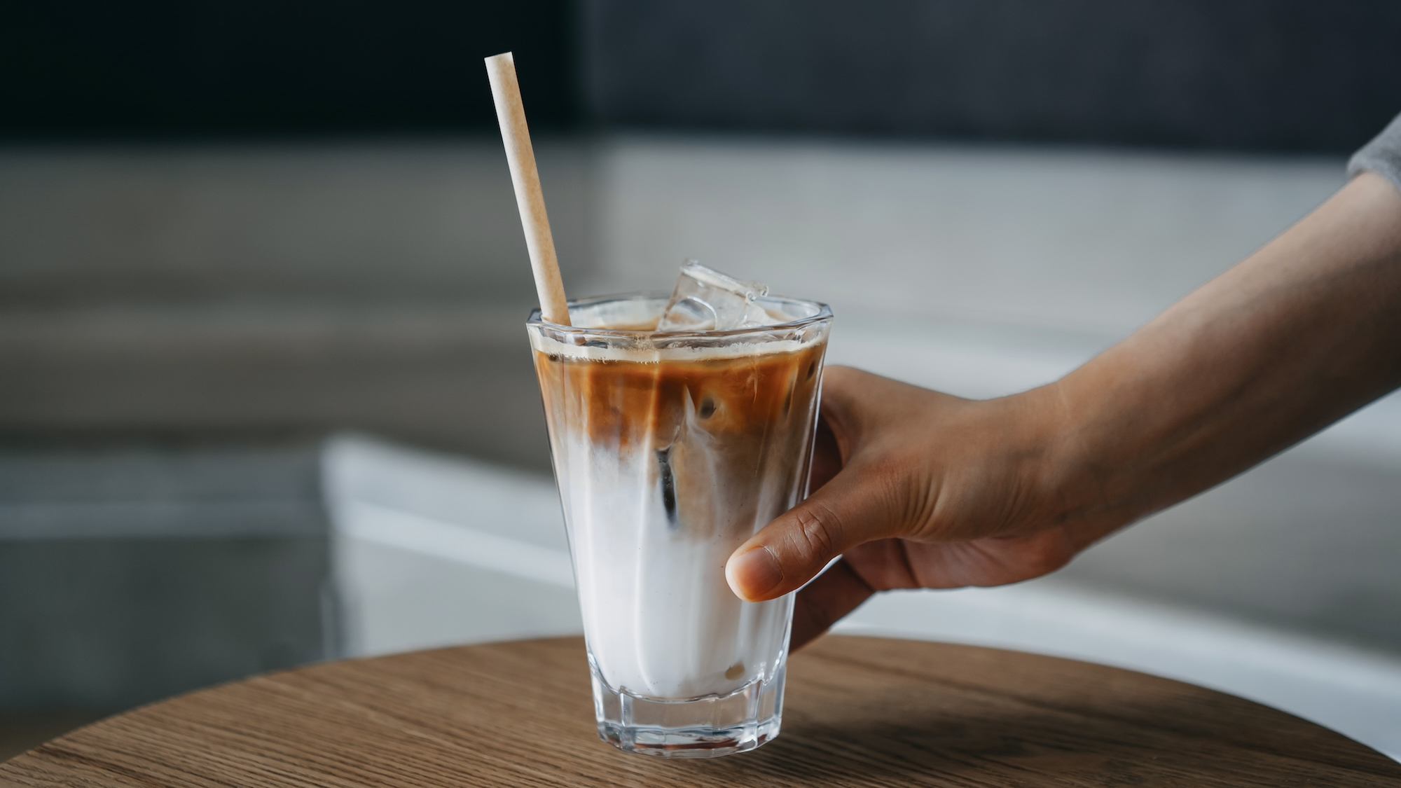 Woman holding an iced coffee