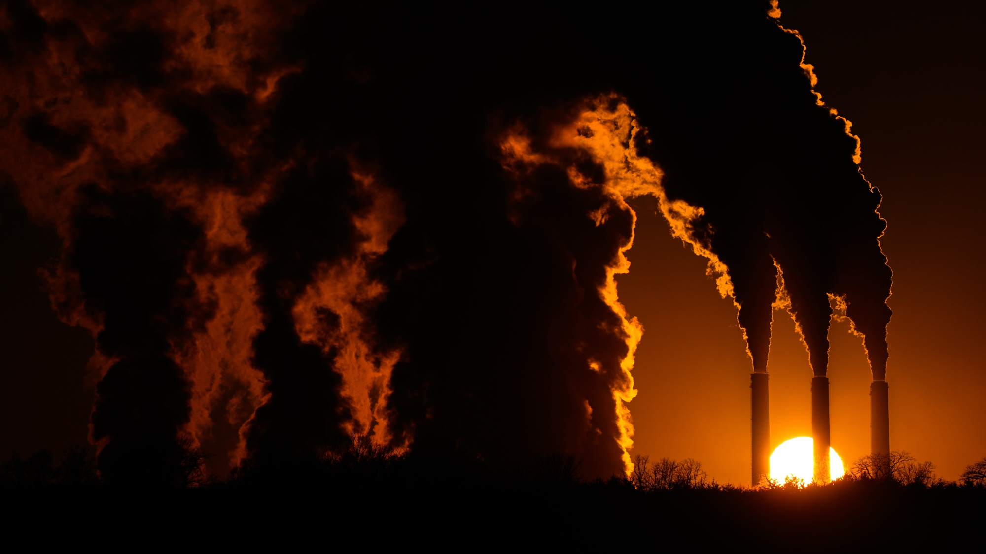 The Jeffrey Energy Center coal-fired power plant operates at sunset near Emmett, Kansas