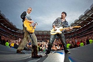 Adam Clayton and The Edge perform on stage for the second night of U2's 360 Degrees World Tour in their home town at Croke Park on July 25, 2009 in Dublin, Ireland