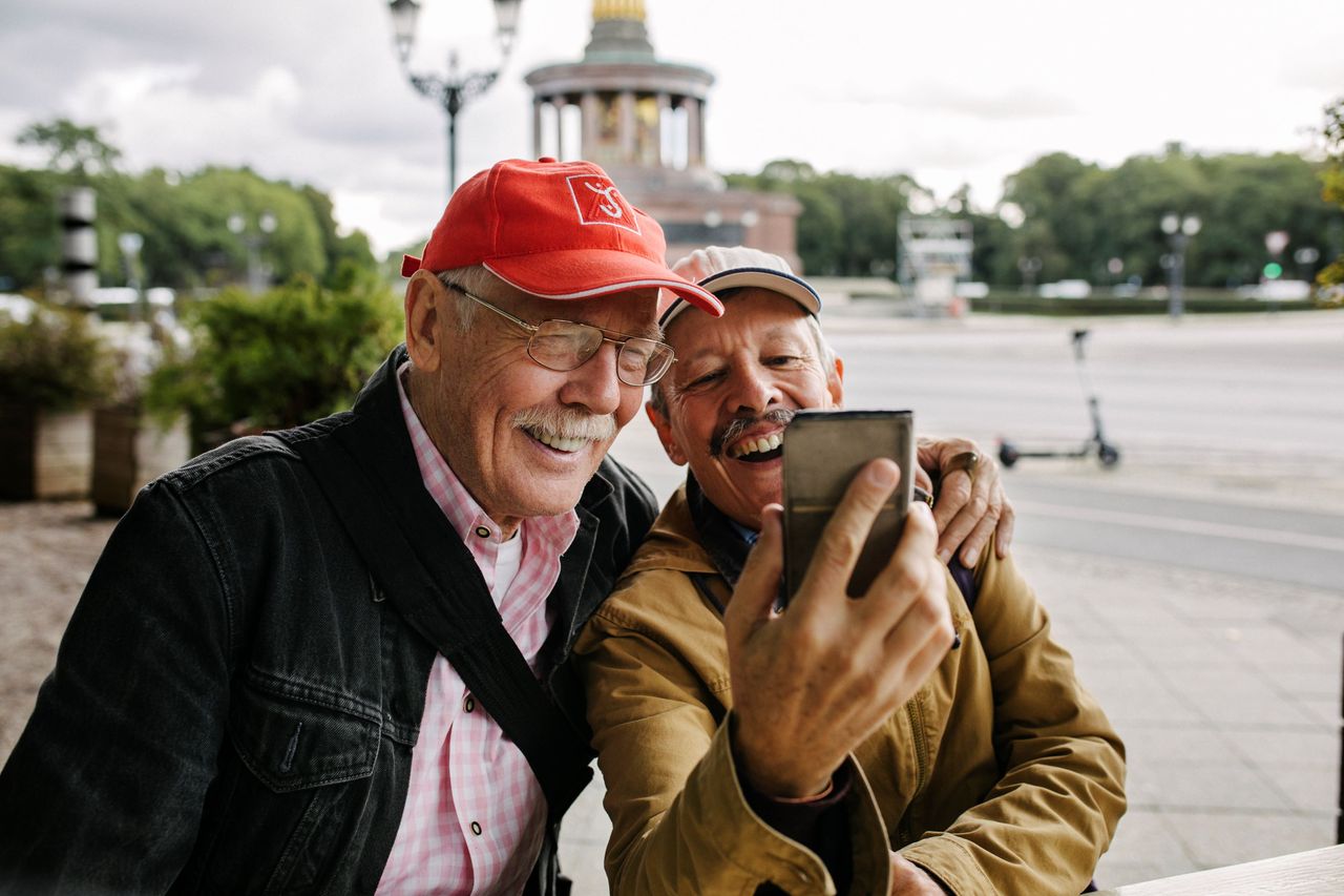 Two people take a selfie while on a trip. 