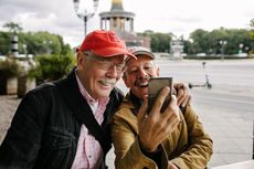 Two people take a selfie while on a trip. 