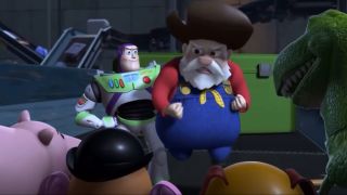 Buzz holding up the Prospector while Ham, Mr. Potato Head, Slink and Rex look at them.