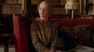 Samantha Bond sits firmly while speaking in Downton Abbey.